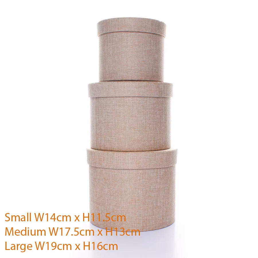 Set of three Tulip textured natural hat boxes in assorted sizes, decorative gift boxes with elegant design.