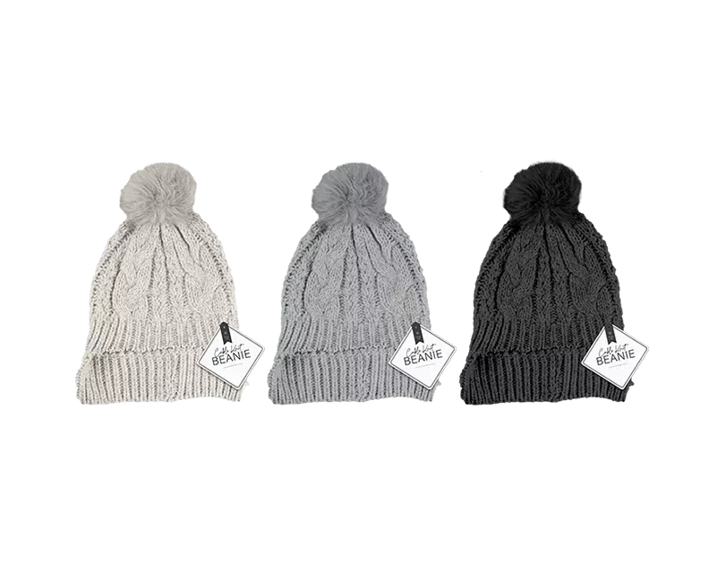 Set of 12 cable knit ladies hats with pom poms from Gem Imports, featuring cozy, stylish winter headwear in various colors.