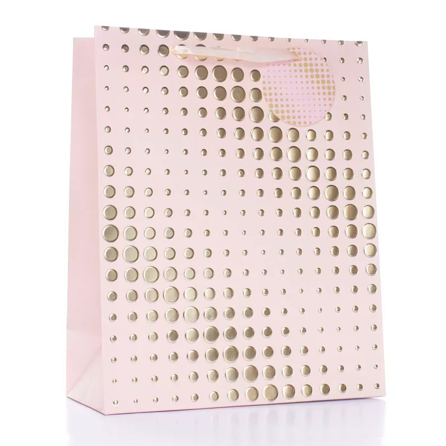 Light pink Tulip gift bag with gold spots, large size, showing a close-up of the patterned design in a set of six.