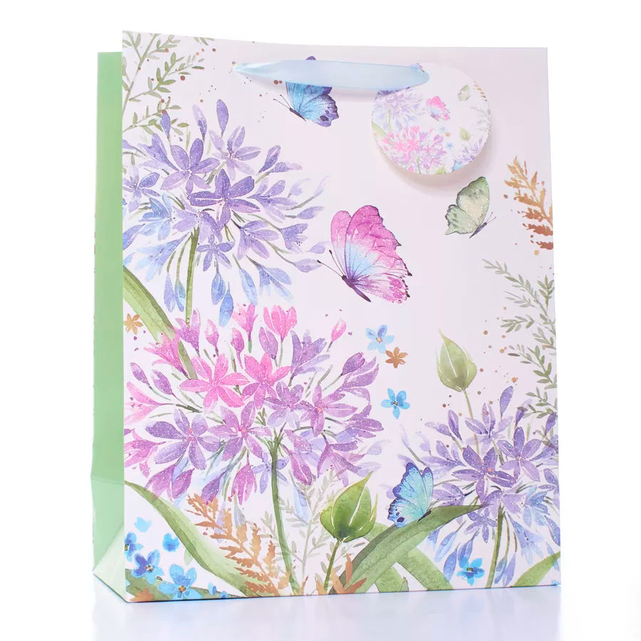 Large Tulip gift bags featuring colorful flower and butterfly designs, set of 6 for special occasions.