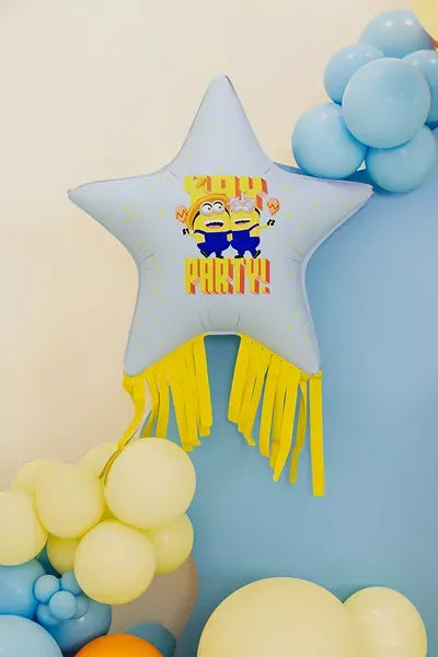 PartyDeco Minion star foil balloon with tassels, 28-inch party decoration featuring a colorful Minion design.