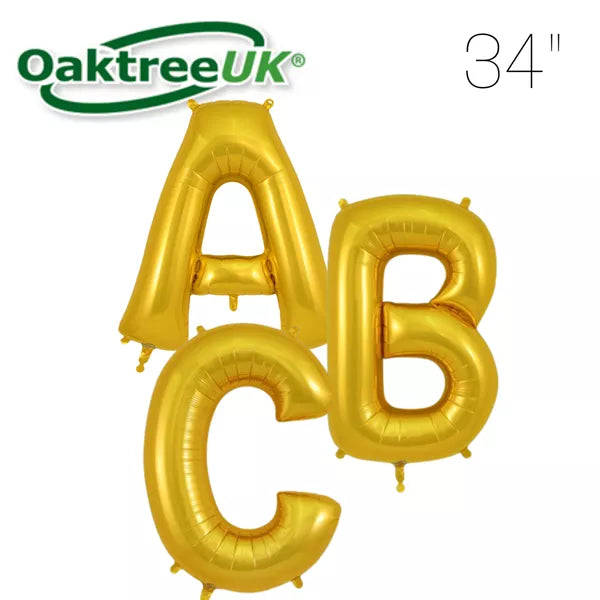 Gold Oaktree foil balloon in the shape of the letter B, measuring 34 inches tall, with shiny metallic finish.
