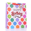 Large glitter gift bags by Tulip, six-pack, with festive decorative designs for wrapping gifts stylishly.