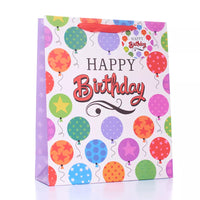Large glitter gift bags by Tulip, six-pack, with festive decorative designs for wrapping gifts stylishly.