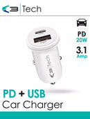 Vibe Centre car charger with PD and USB ports connected to a vehicle's power socket, charging electronic devices.