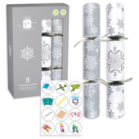 Eight silver and white 12-inch cracker party accessories by IG Design Group, featuring festive designs for celebrations.