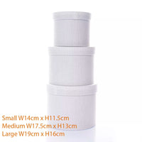 Set of three white textured Tulip gift hat boxes in assorted sizes, perfect for gift packaging and storage.