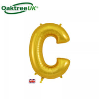 Golden Oaktree foil balloon in the shape of the letter C, 34 inches tall, with shiny metallic surface and smooth curves.