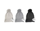 Set of 12 cable knit ladies hats with pom poms from Gem Imports, featuring cozy, stylish winter headwear in various colors.