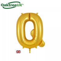 Gold Oaktree foil balloon in the shape of the letter Q, 34 inches tall, shiny metallic finish, suitable for celebrations or decorations.