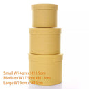 Set of three textured yellow gift hat boxes in assorted sizes by Tulip, perfect for gift packaging and storage.