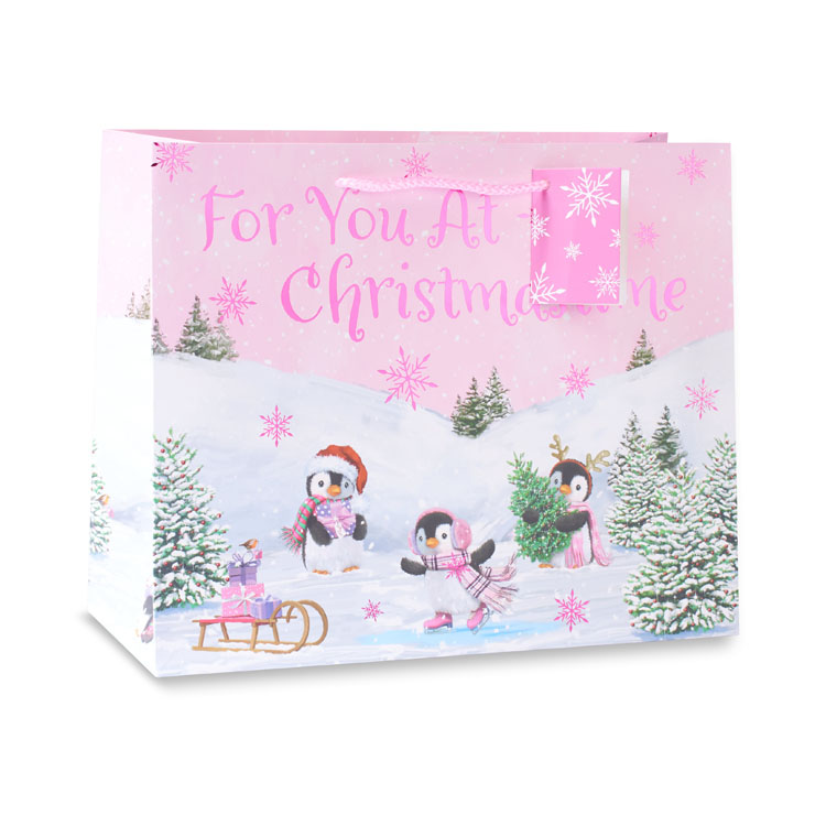Set of 12 large landscape gift bags featuring playful penguin designs by Wraptastic, perfect for holiday or birthday presents.
