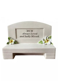 David Fischoff Memorial Bench Mum keepsake in a decorative container with a vibrant yellow flower and personalized memorial message.