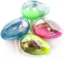 Kandy Toys Alien Egg Pod toys, 12-pack featuring colorful plastic alien egg capsules with playful designs and textures.