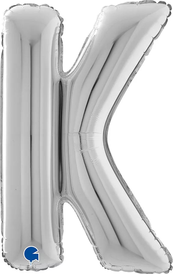 Silver 26-inch Grabo foil letter K balloon, shiny metallic finish, floating in the air for celebration decor.