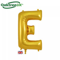 Gold Oaktree foil balloon in the shape of the letter E, measuring 34 inches, with shiny metallic finish.
